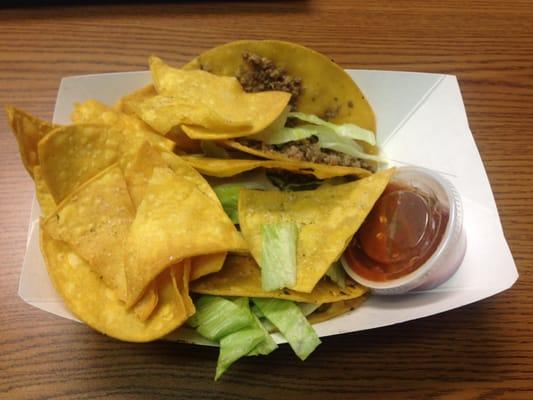 Three beef tacos with some chips