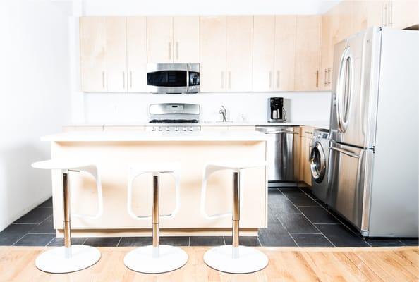 Full modern kitchen with vaulted ceiling.