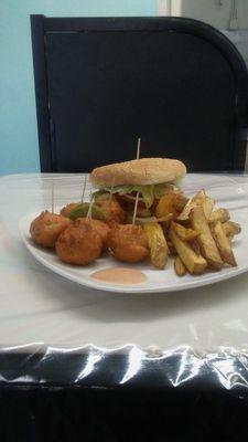 Classic conch burger, golden conch fritters and homemade fries.