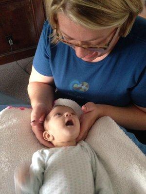 Dr. Baker adjusting a baby as featured on KCTV5