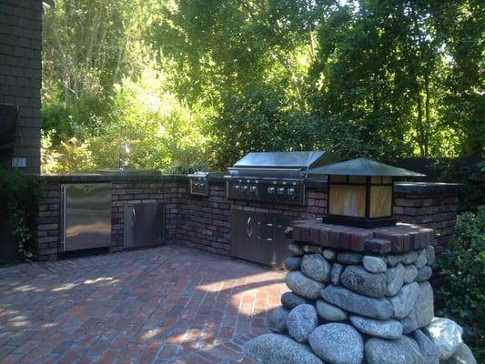 New outdoor kitchen with hard scape brick and stonework