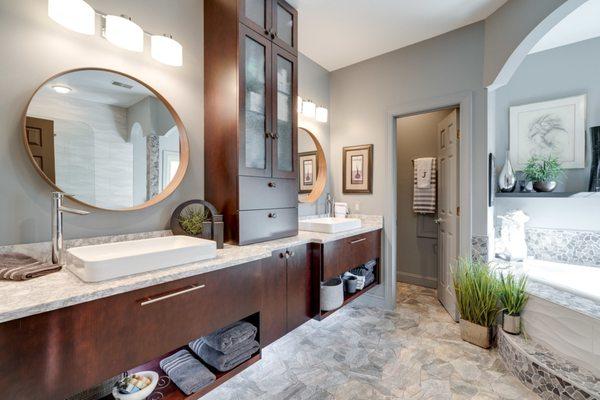 Modern slab door with warm cherry finish in the master bathroom.