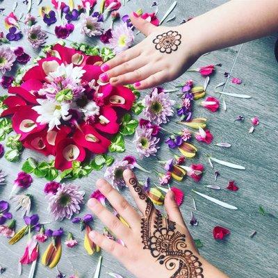 Henna (mendhi) and flower mandala and opening celebration.