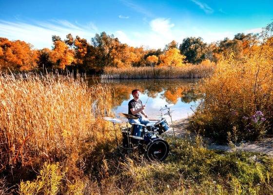 My son drumming in nature- cool!