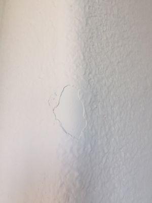 Chunk of paint missing in entry way