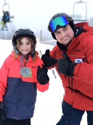 Devin Our Ski School Instructor with his student.