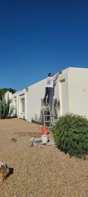 Exterior stucco repair and repaint.