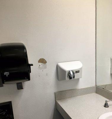 Men's restroom damage