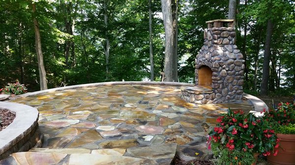 Raised paver patio with fireplace