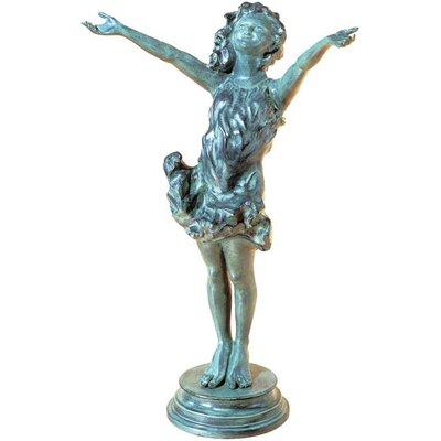 La Brezza sculpture. Girl in Bronze, on pedestal in garden.