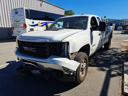 Front end collision repair on GMC pickup