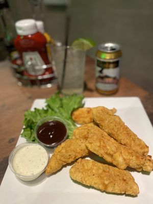 Chicken strips with bbq and ranch dipping sauce with a delicious ginger beer.