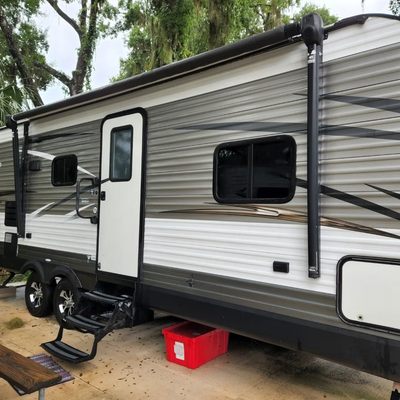 Pressure wash rv from roof to concrete.