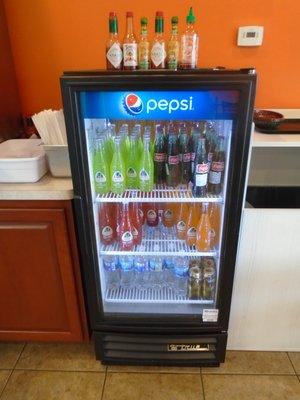 A small cooler with other beverage options like Jarritos soda.