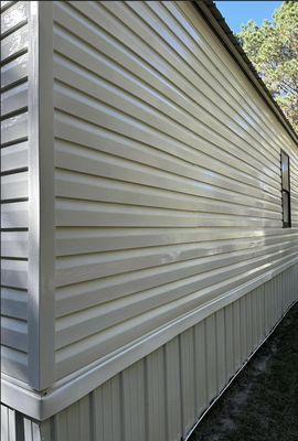 ORGANIC GROWTH HAS BEEN REMOVED OFF VYNIL SIDING. After our exterior house wash service