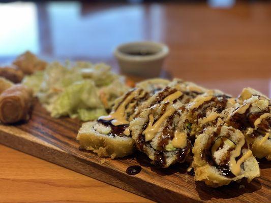 Golden Cali roll w avocado, crab meat and cucumber .