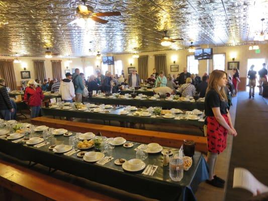 Steamboat tour crowd assembles for a family style buffet.