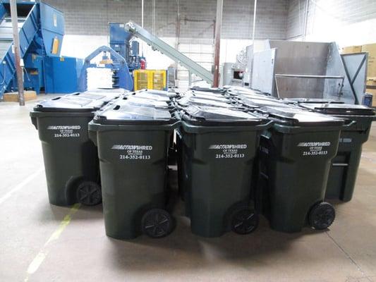 Shredding collection containers at Action Shred of Texas' facilities in Dallas, TX.