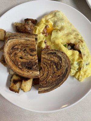 Western omelet with home fries and marble rye toast