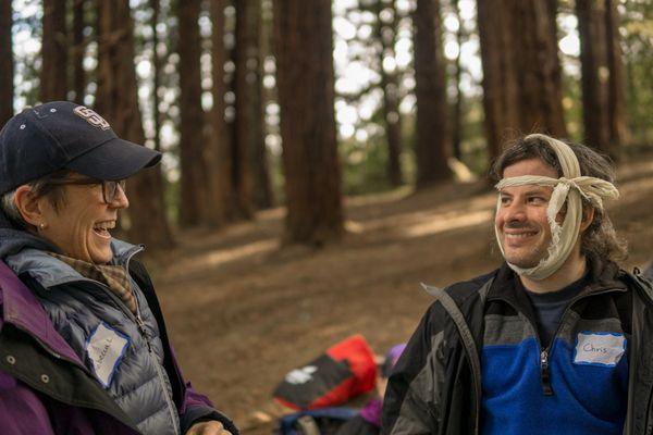 Practicing bandaging and dressing during a With The Wild Things Wilderness First Aid Class