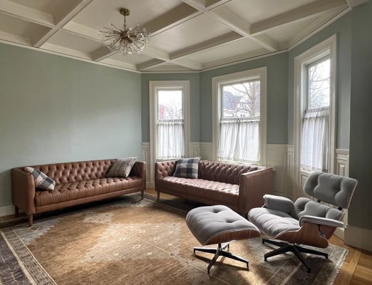 This wall color is absolutely stunning with the couches and rug. The room is still a work in progress, but looking good so far!