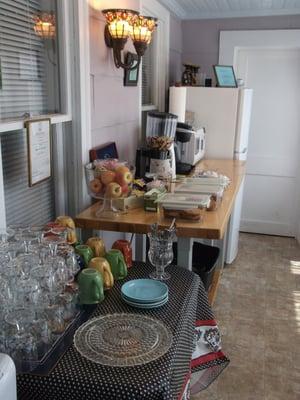 The snack room/area.  Fridge for guest use.  Also cups, bowls, spoons, utensils.