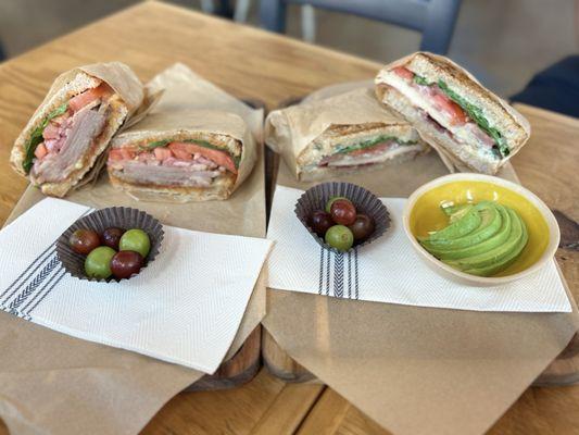 left to right: farmhouse brisket panini, garlic chicken panini