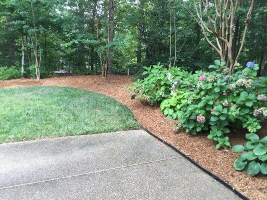 Cypress mulch hand spread