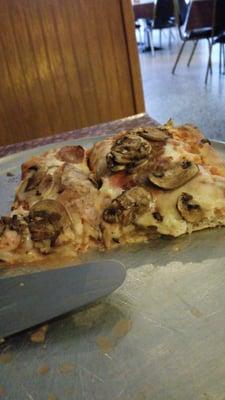 Sicilian style sausage and mushroom pizza