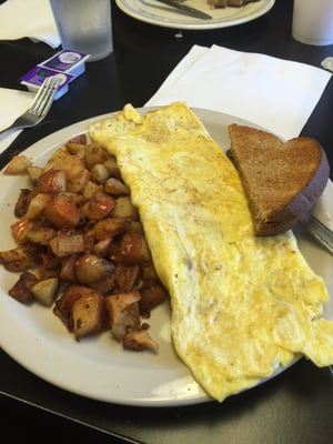 Bacon omelet with home fries and toast.