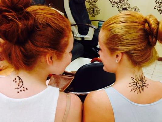 Friends having fun with Henna