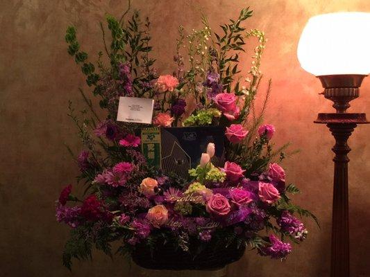 Flower arrangement with music album of YES from his family by Monroe Florist