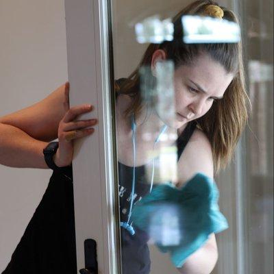 One of our incredible cleaning technicians hard at work ensuring every inch of glass is streak-free!