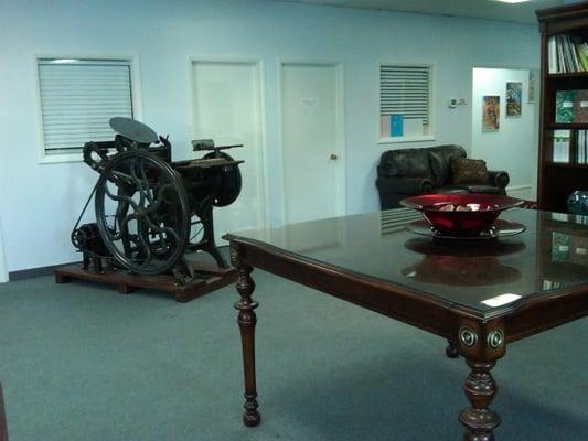 Customer service room with our 1890 Chandler & Price handfed press. Please come by and we will even fire it up for you.