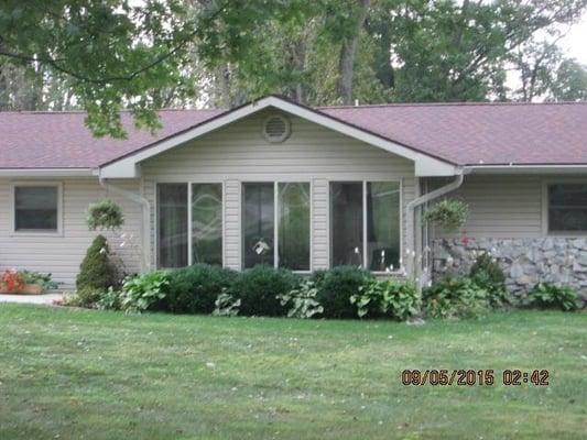 Beautiful ranch 3 bedrooms 2 bath with two separate living areas and enclosed front porch across from Lake Mohee.