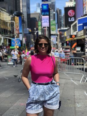 Neon bodysuit and vintage denim shorts from Mint Market