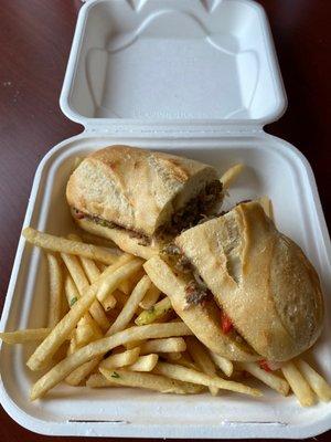 Philly cheesesteak with garlic fries