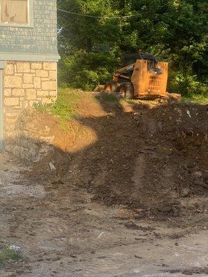 Grading out for a pad up top plus entry way