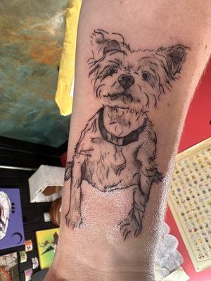 Tattoo of a small Yorkshire terrier