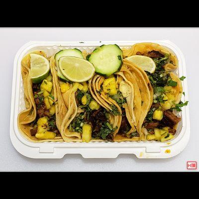 Large 5" tacos for $3 each. This plate of 4 al pastor (roast pork) tacos was $12 all-in....