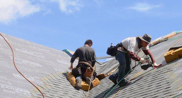 Our roofing contractors completing a roof repair job in Grosse Pointe