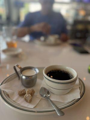 Coffee with cream and raw sugar