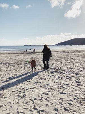 Nanny "Sierra" and our son walking on the beach. She was amazing! Love this service!