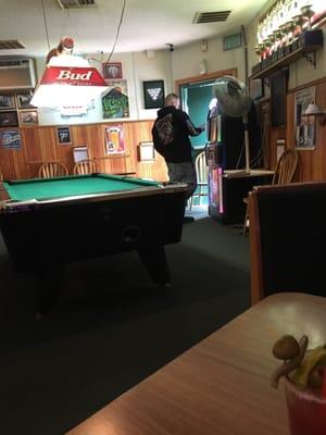 Jukebox and one of the two pool tables