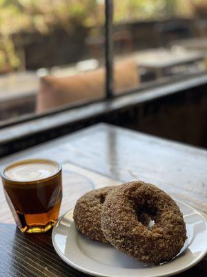 Gibraltar with oat milk and coffee donut