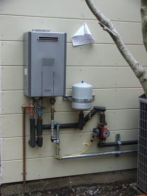 tank-less water heating system with re-circulation  system and pump timer, installed by us