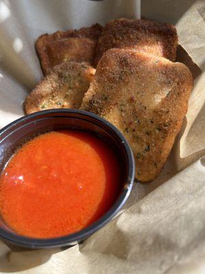 Fried cheese ravioli with our homemade sauce