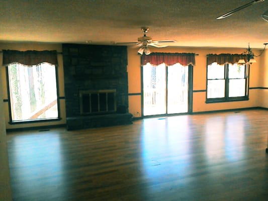 Living Area with a Wood Burning Fireplace. Wait till you see the view from these windows.