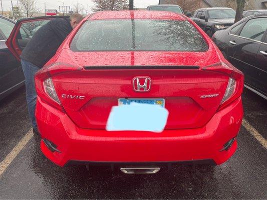 Civic sport trim has center exhaust.