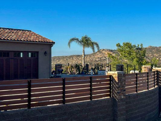 Hardscape and fencing on custom garage.